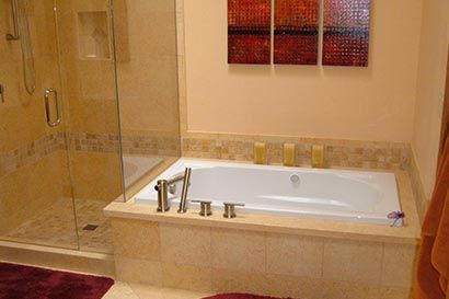 Bathtub and glass shower remodeled by Assurance Builders 