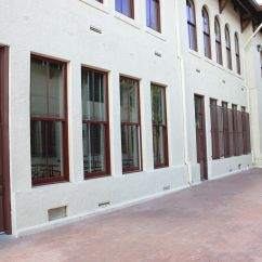 Maroon colored framed windows and doors. 