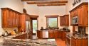 Cherry wood colored cabinets in a kitchen