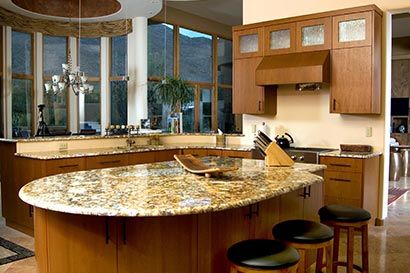 Kitchen island remodeled by Assurance Builders. 